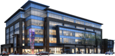 Modern commercial building at night with illuminated windows